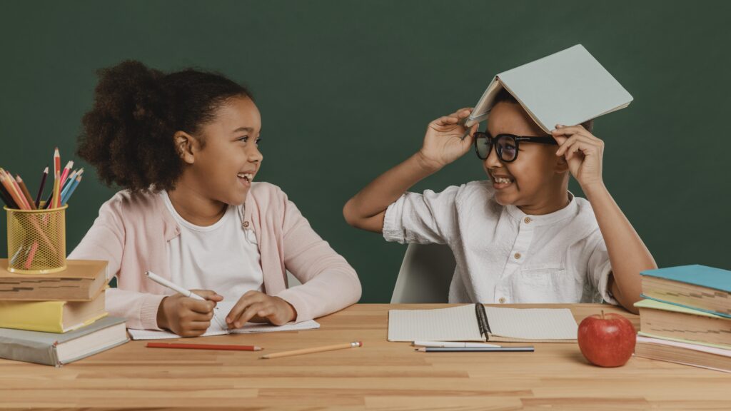 girl-boy-having-fun-with-school-supplies